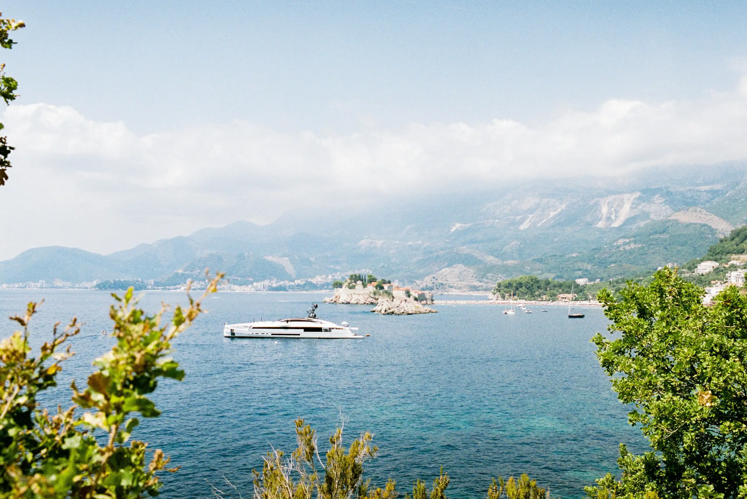 Superyacht cruising along Montenegro’s scenic Adriatic coast, representing a first-time yacht charter experience with coastal views and private cruising.